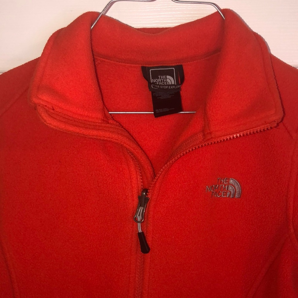 Woman’s Orange North faced jacket XS